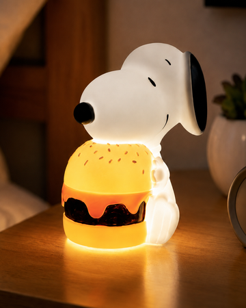 Snoopy Burger USB-C mood light with warm glow on a bedside table